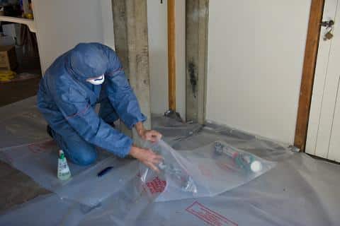 Plumber backfilling trench